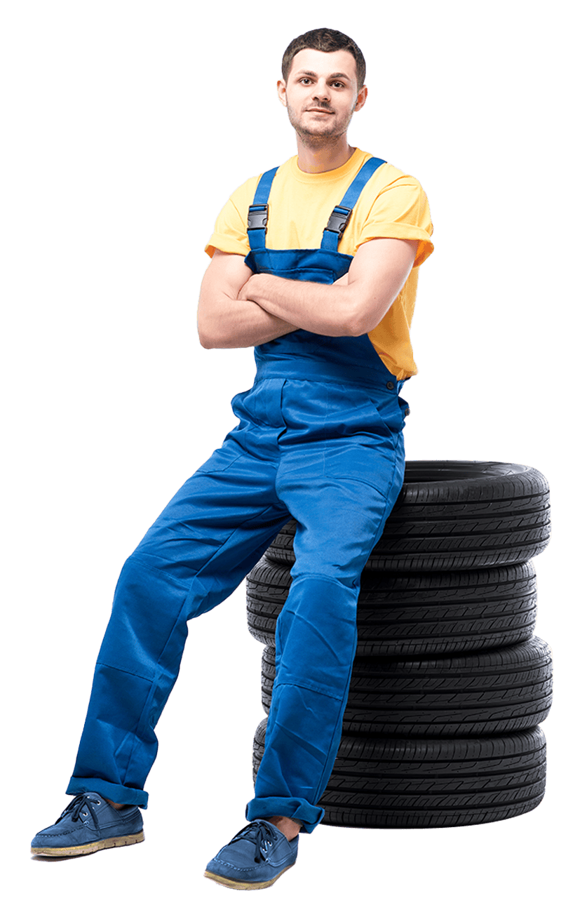 Man sitting on tires ready to perform tire & truck trailer repair services